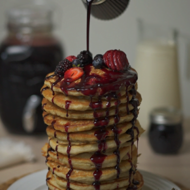 elderberry syrup poured on pancakes