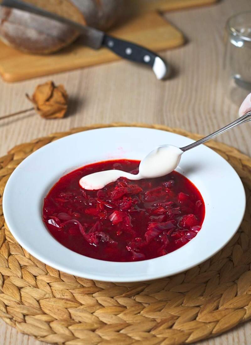 Serving vegan borscht.